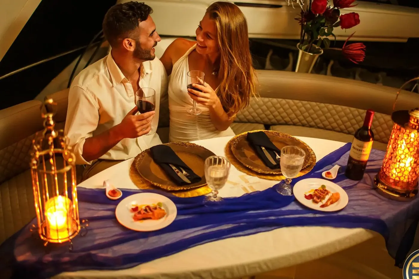 Candlelit romantic yacht dinner setup