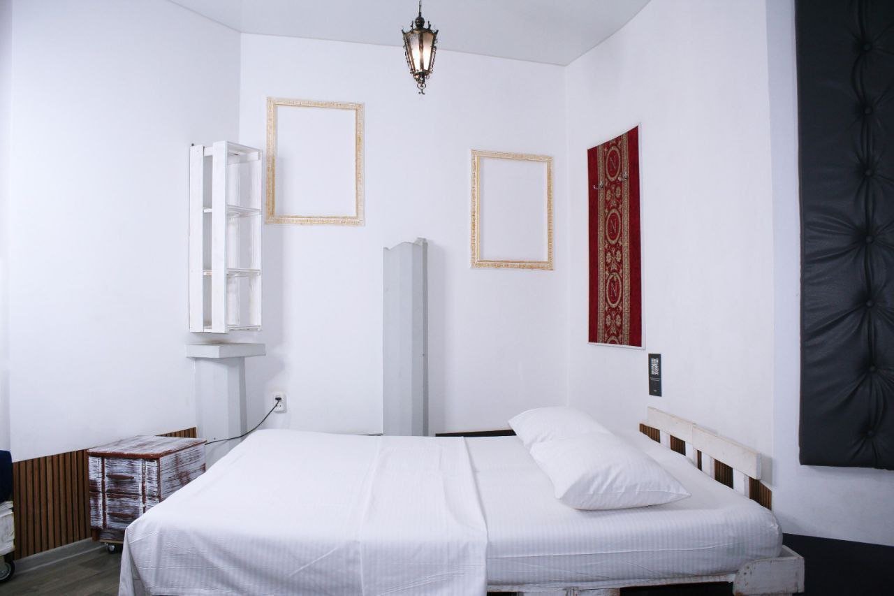 white bed linen on bed