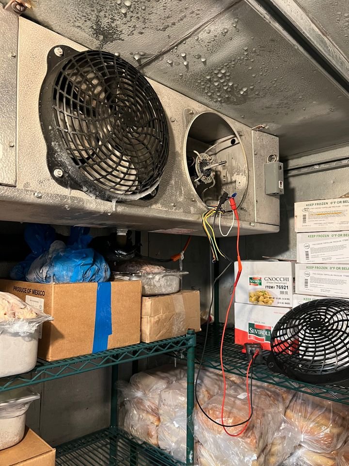 Walk-in cooler evaporator coil and fans