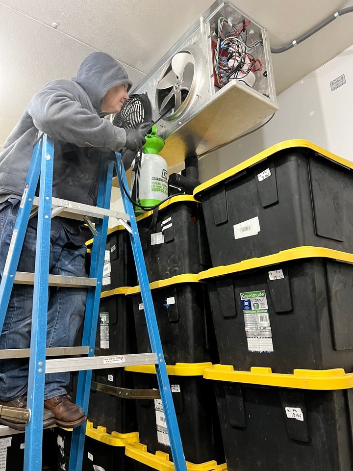 ARHC Service technician working on a walk-in cooler evaporator
