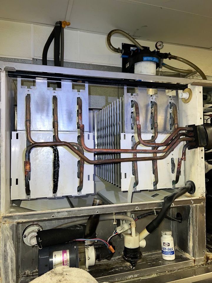 Commercial ice machine opened up for service