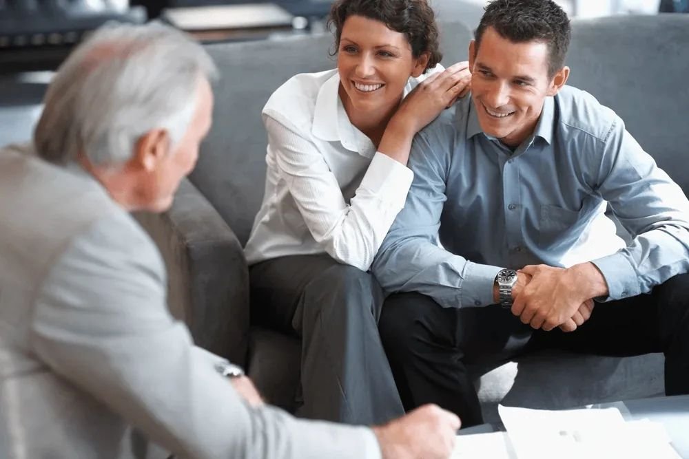 Homeowners discussing their property and coverage with an advisor